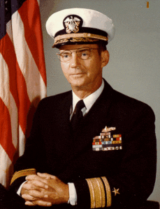 A man in uniform with his arms crossed.