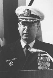 A black and white photo of a man in uniform.