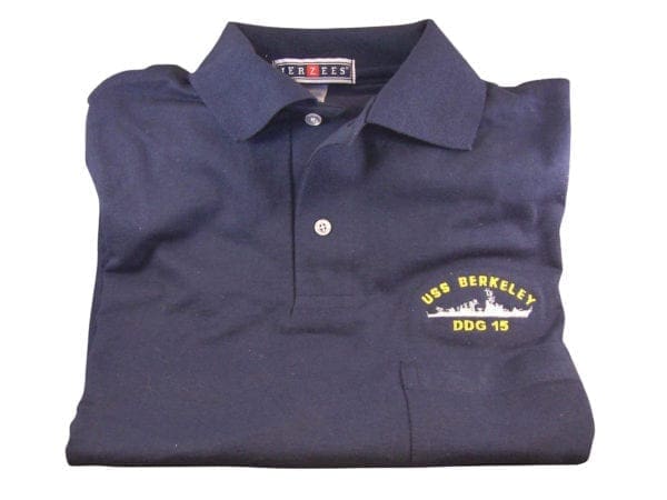 A navy polo shirt with an emblem on it.