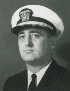 A black and white photo of a man in uniform.